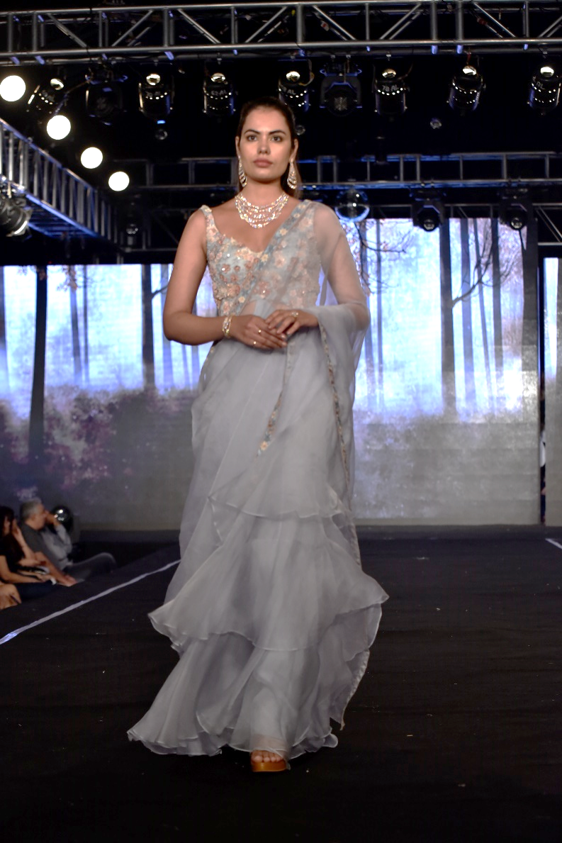 Ruffle layered gown with an open pallu