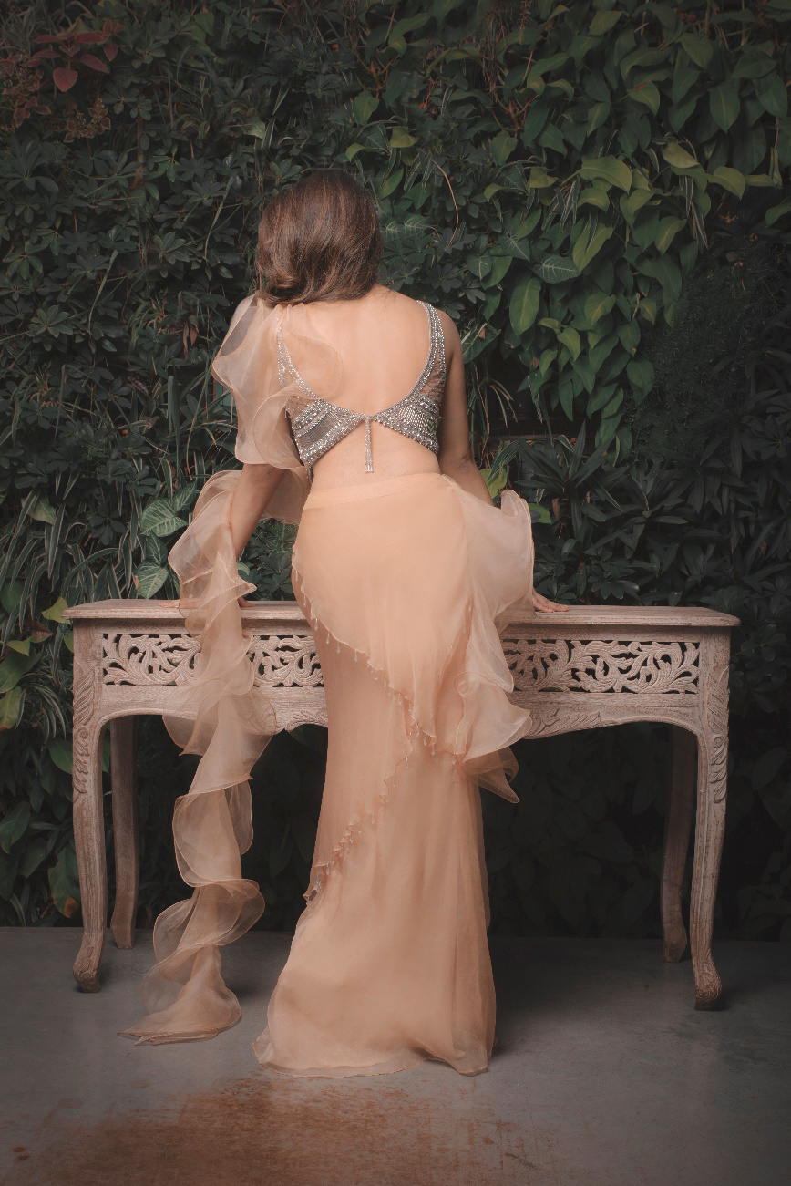 Ruffle saree gown paired with encrusted blouse