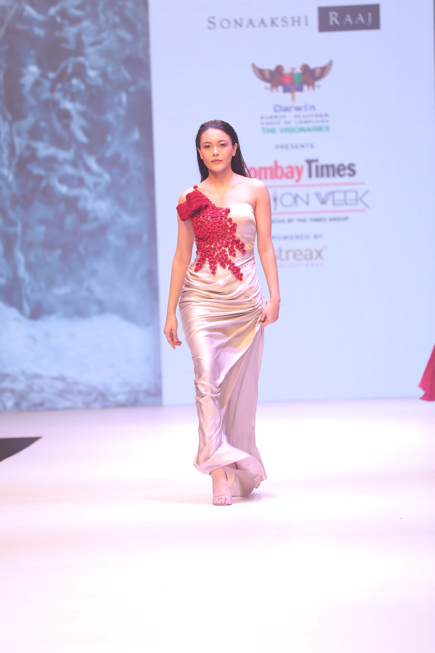 Draped gown with cherry blossom embellishment