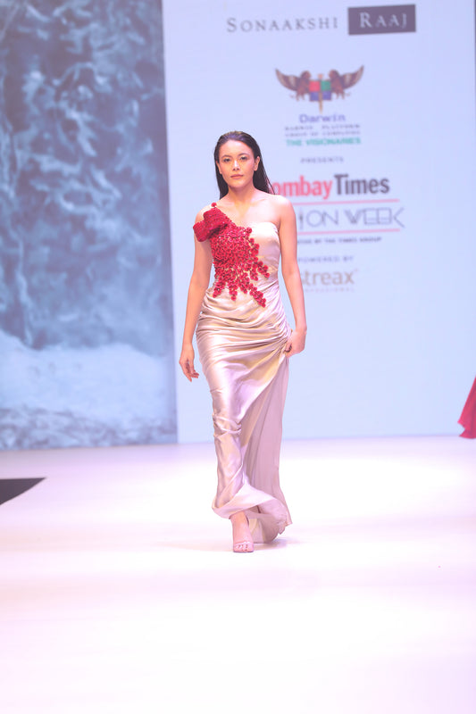 Draped gown with cherry blossom embellishment