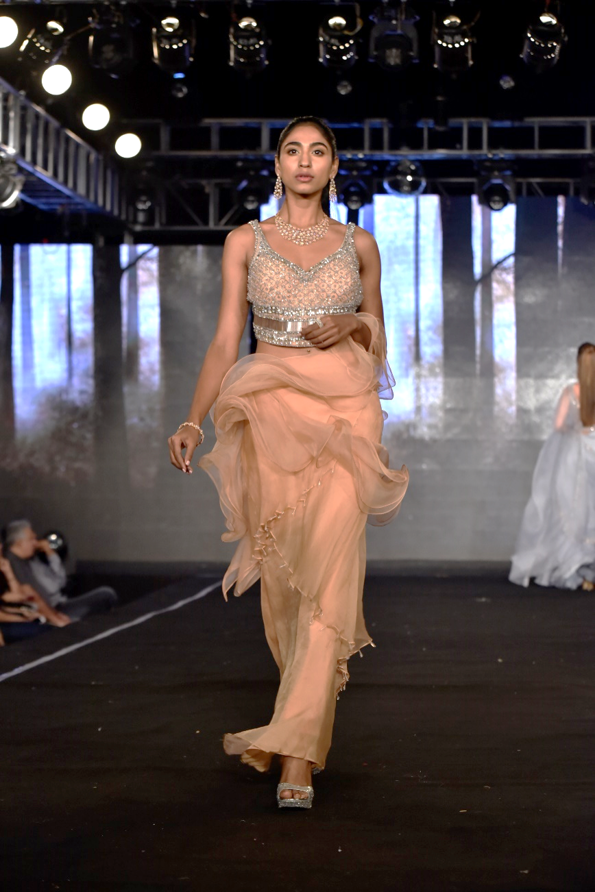 Ruffle saree gown paired with encrusted blouse