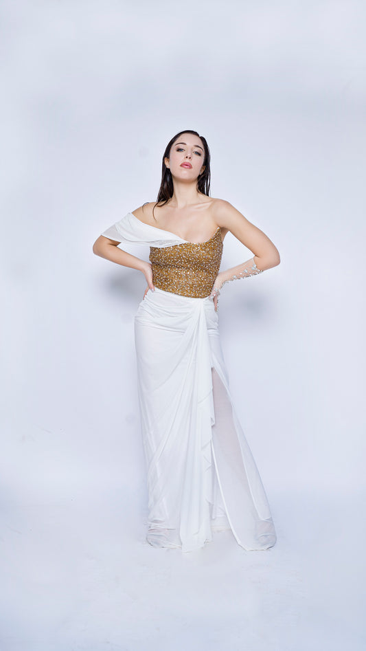 Gold encrusted bustier with ivory draped gown