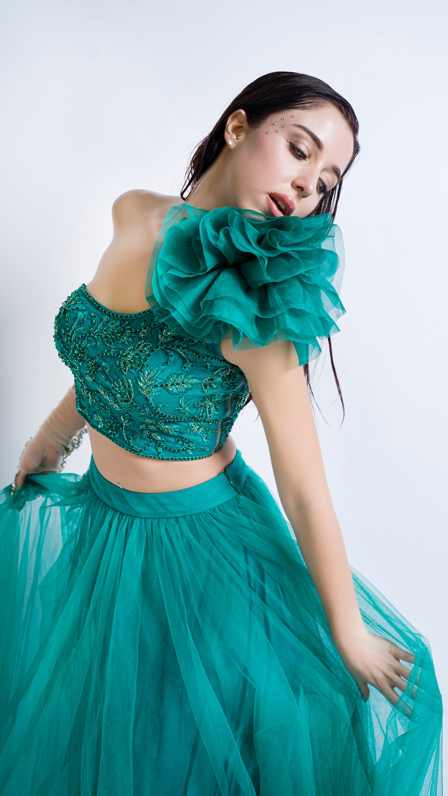 Teal green one shoulder rose embroidered lehenga set