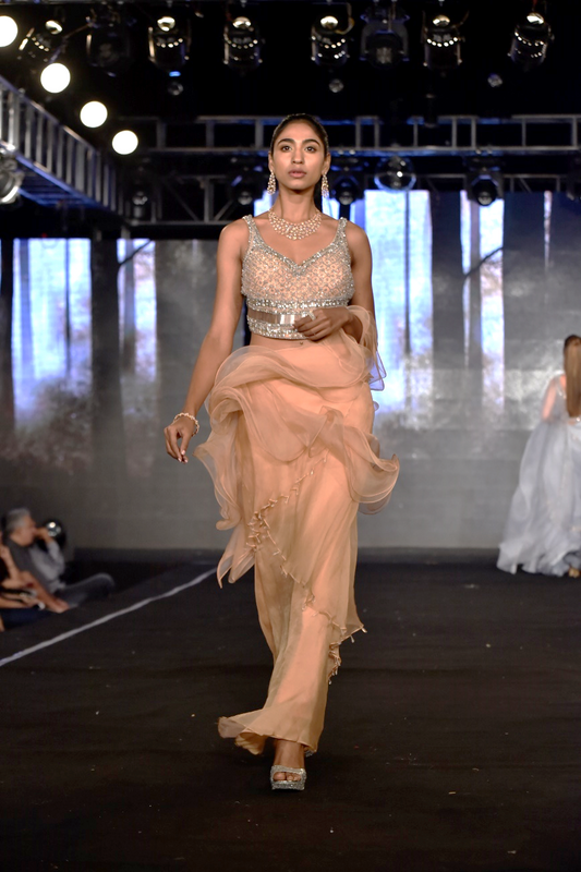 Ruffle saree gown paired with encrusted blouse