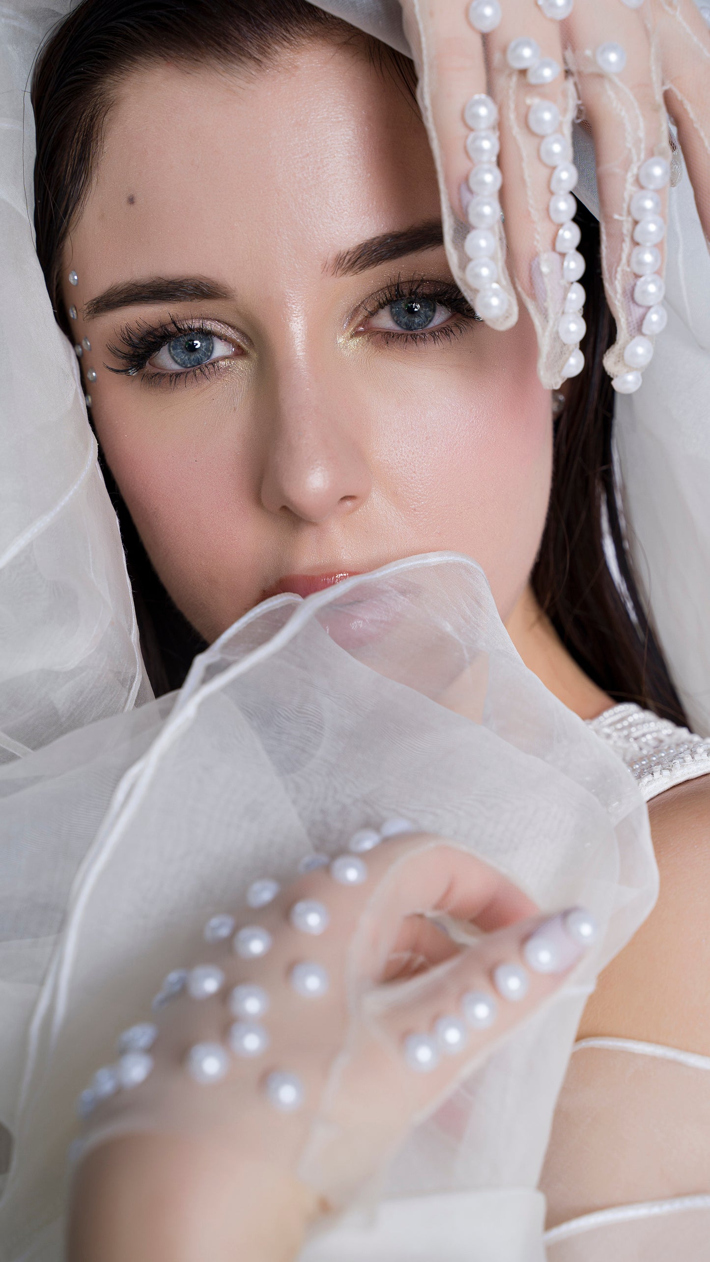 Pearl embellished blouse with organza ruffled draped gown