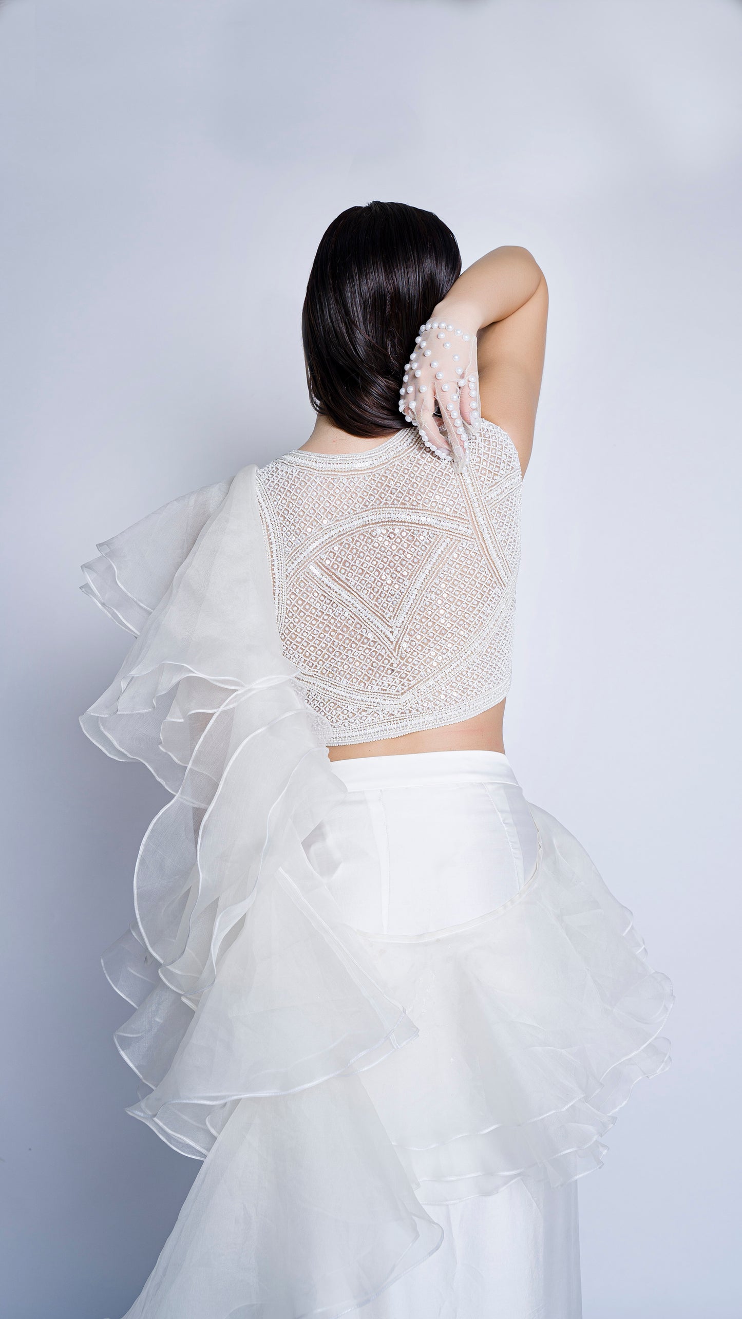 Pearl embellished blouse with organza ruffled draped gown