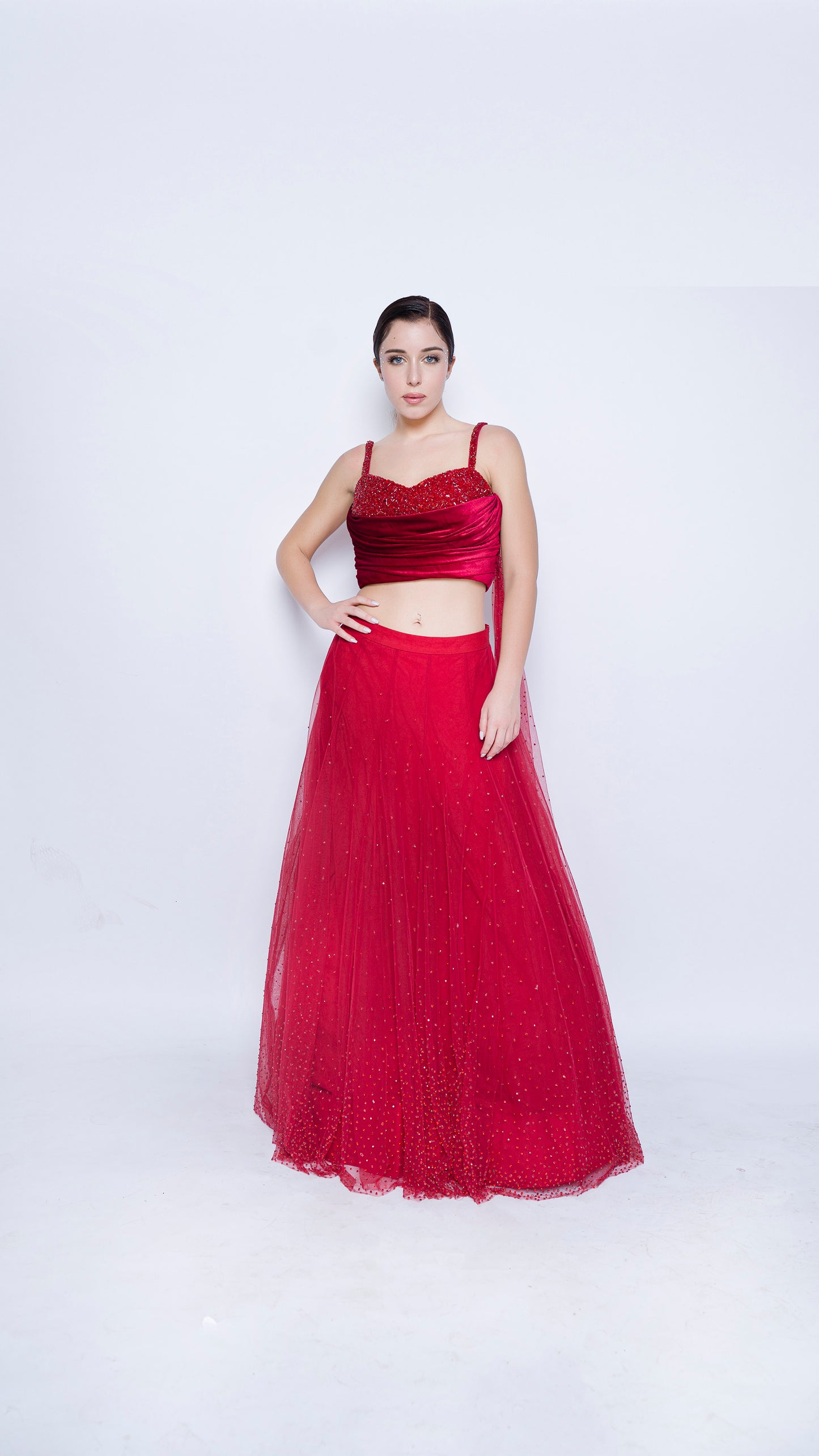 Red encrusted cowl drape blouse with crystal splatter lehenga set