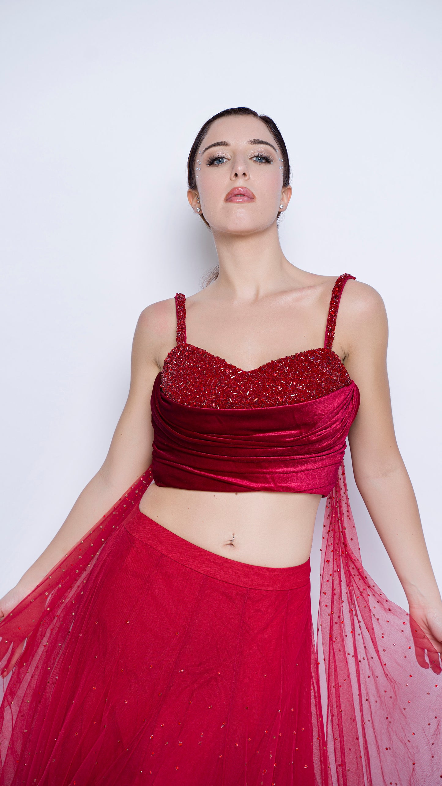 Red encrusted cowl drape blouse with crystal splatter lehenga set