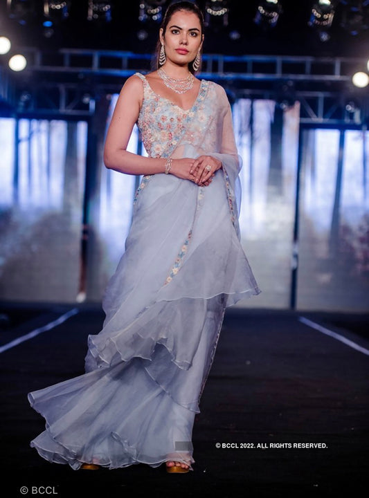 Ruffle layered gown with an open pallu